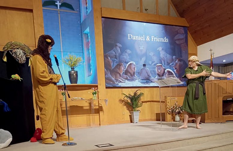 Nelson and Blake reenact the story of Daniel and the Lion’s Den.