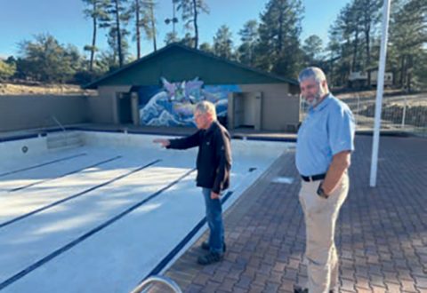 John Houghton (left) shows Arizona Conference President Ed Keyes (right) inspect completed work.