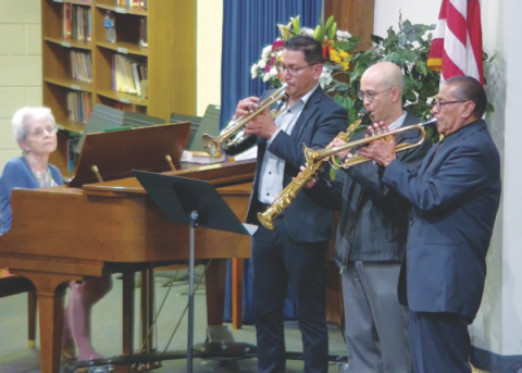 Joel Avalos, Ryan Morada, and Basilio Avalos play instruments at vespers.