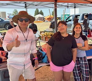 Pastor Uridam Cipriano Urbano (left) attends the camporee with the Adonai Pathfinder Club.