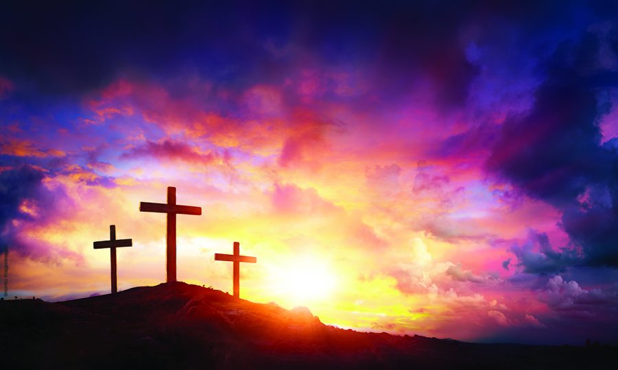 Three Crosses On Mountain With Red Clouds